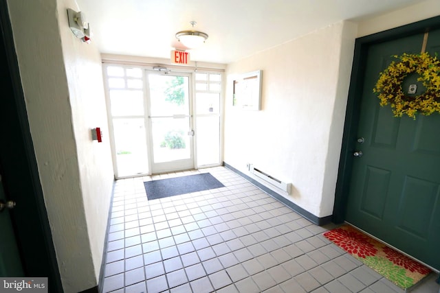 tiled entryway with baseboard heating