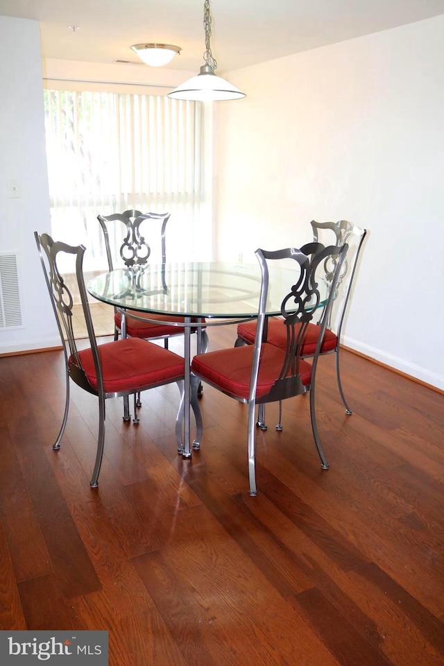 dining room with hardwood / wood-style flooring