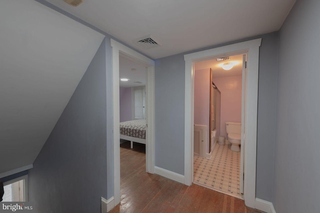 corridor featuring hardwood / wood-style flooring