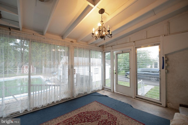 unfurnished sunroom with lofted ceiling with beams and an inviting chandelier