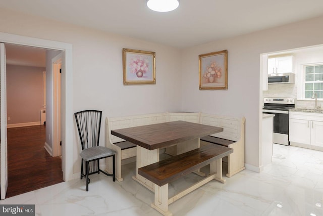 dining room featuring sink