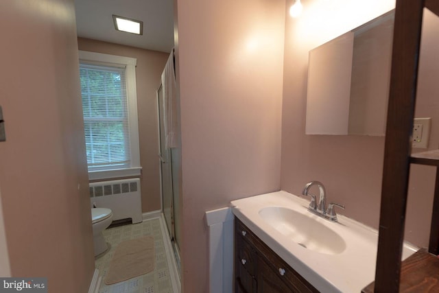 bathroom with toilet, radiator heating unit, an enclosed shower, and vanity