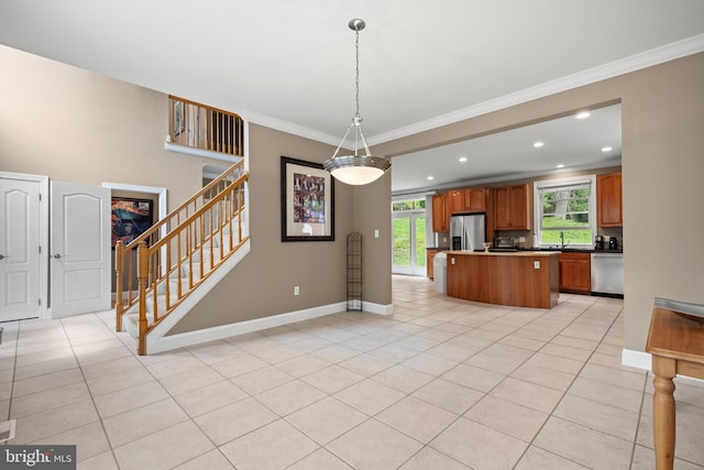 kitchen with stainless steel appliances, a kitchen island, crown molding, pendant lighting, and light tile patterned flooring