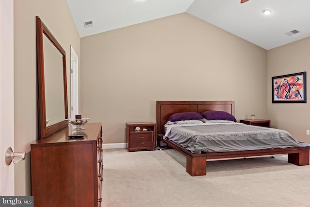 carpeted bedroom with lofted ceiling