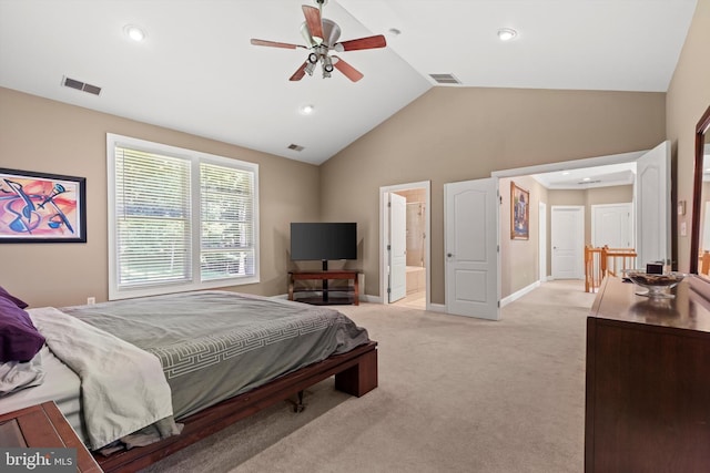 carpeted bedroom featuring ceiling fan, connected bathroom, and vaulted ceiling