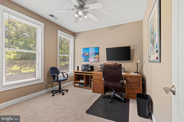 office with ceiling fan, plenty of natural light, and light colored carpet