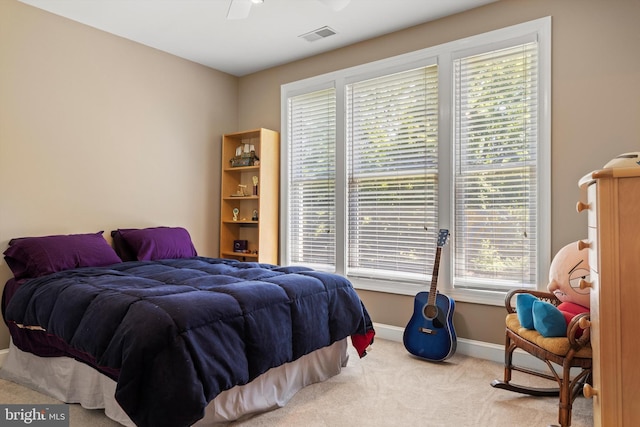 carpeted bedroom featuring ceiling fan