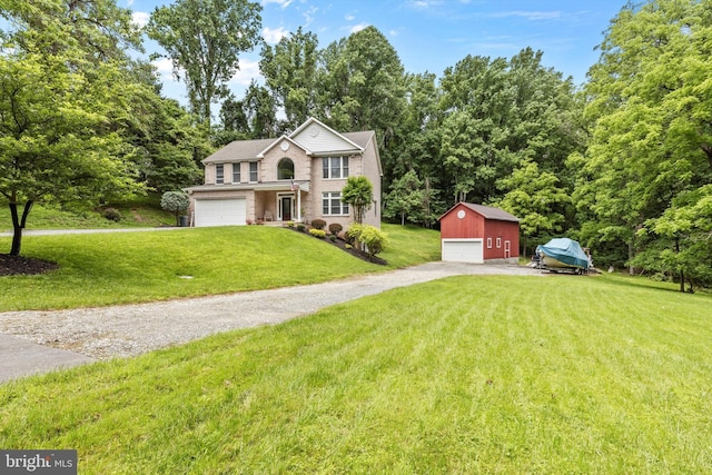 view of front of home with a front lawn and an outdoor structure