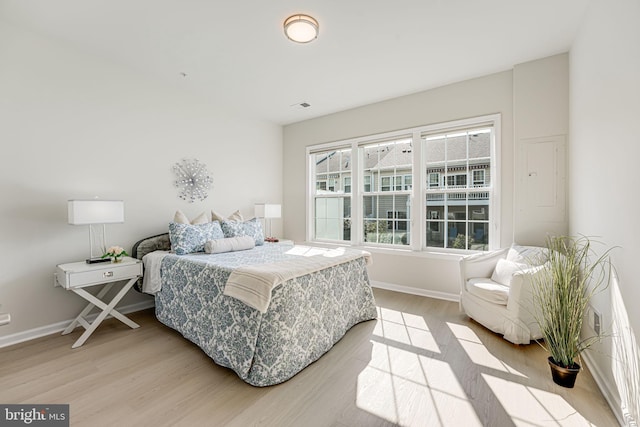 bedroom with light hardwood / wood-style flooring