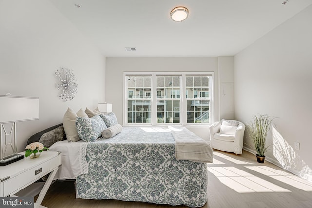 bedroom with wood-type flooring