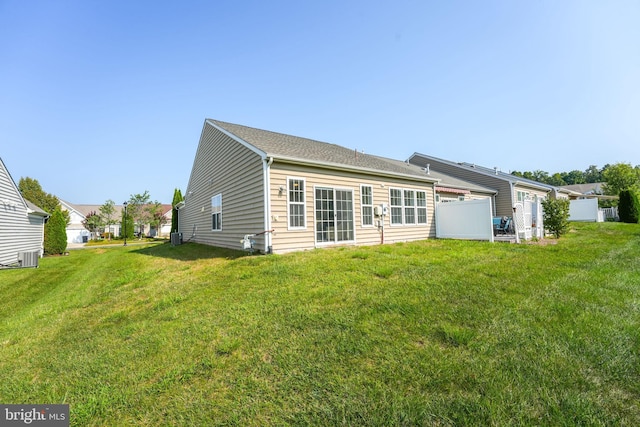 rear view of house with a lawn