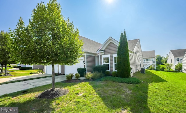 view of property exterior featuring a yard and central air condition unit