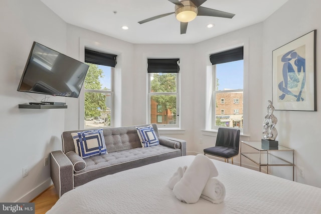 bedroom featuring ceiling fan and hardwood / wood-style flooring