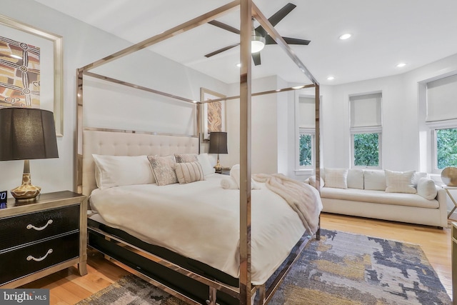 bedroom with ceiling fan and light wood-type flooring