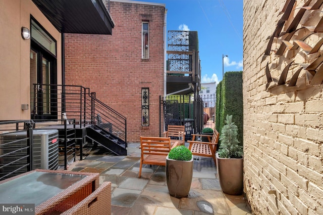 view of patio with central AC unit