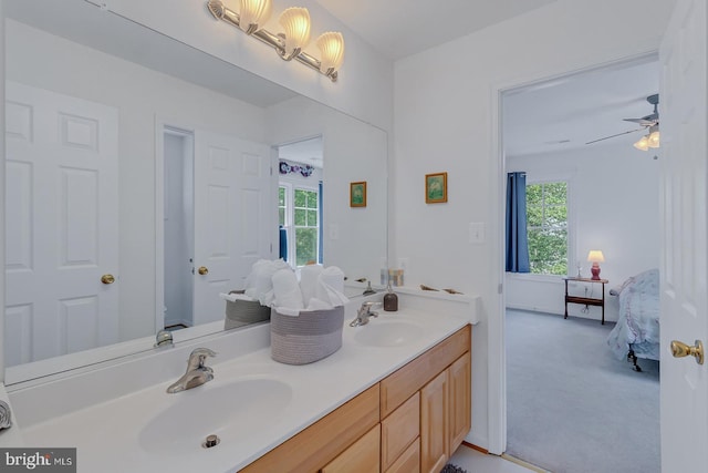 bathroom with double sink vanity and ceiling fan