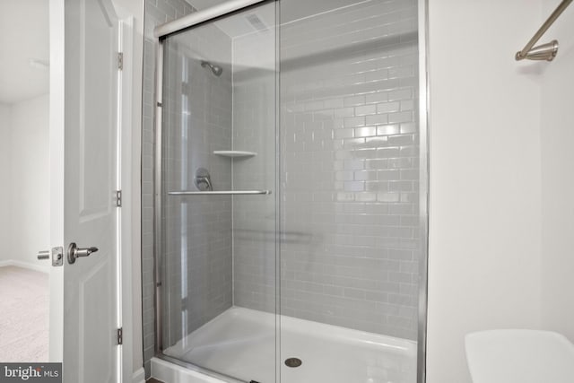 bathroom featuring an enclosed shower