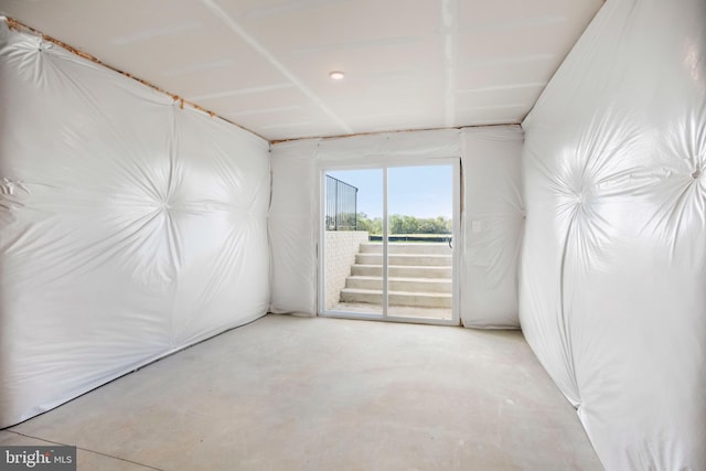 empty room with concrete flooring