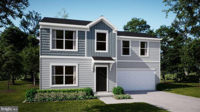 view of front of property with a garage and a front yard