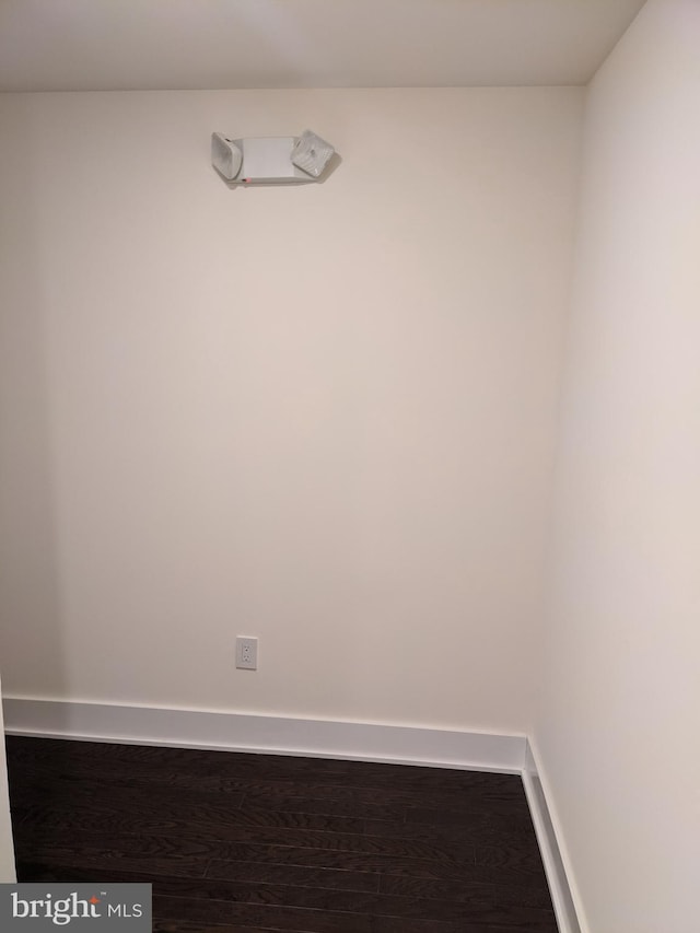 empty room with hardwood / wood-style floors