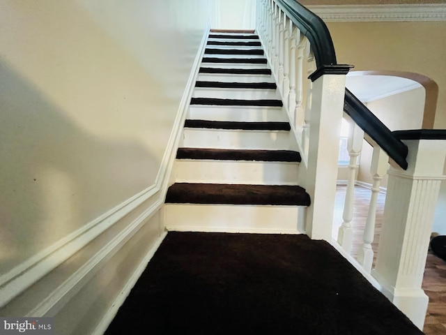 stairway with crown molding