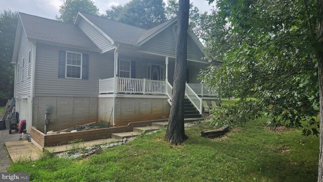 37680 Frischholz Ct, Mechanicsville, MD 20659 - rear view of house featuring covered porch and a lawn