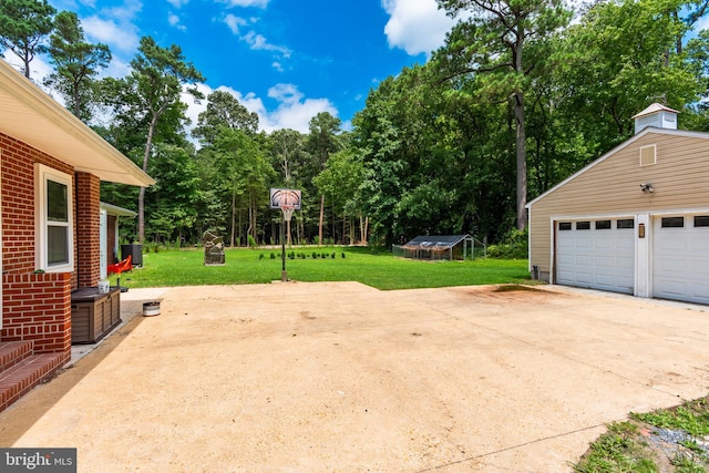 exterior space featuring a garage and an outdoor structure