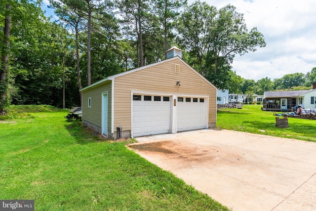 garage with a yard