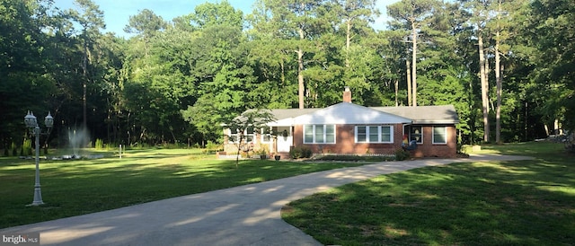 ranch-style house with a front lawn