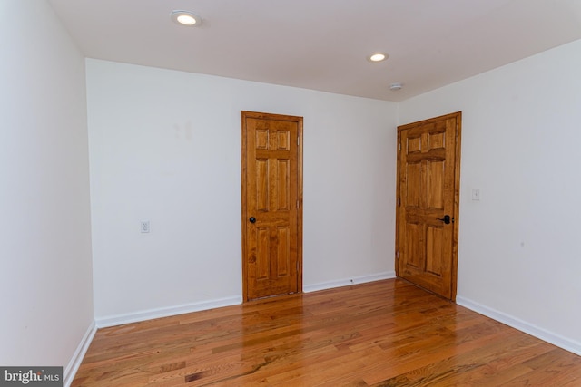 spare room with light hardwood / wood-style flooring