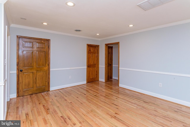 unfurnished room featuring light hardwood / wood-style floors and ornamental molding