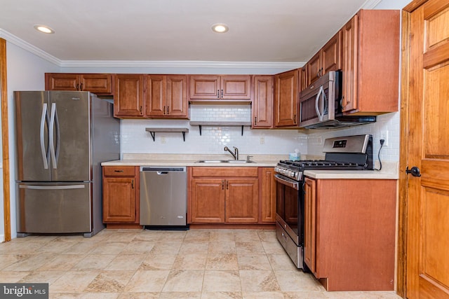 kitchen with appliances with stainless steel finishes, backsplash, crown molding, and sink