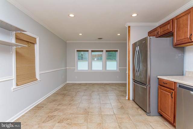 kitchen with decorative backsplash, ornamental molding, and appliances with stainless steel finishes