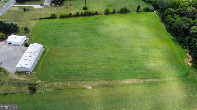 birds eye view of property featuring a rural view