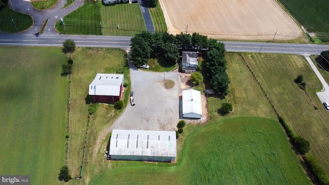 birds eye view of property featuring a rural view