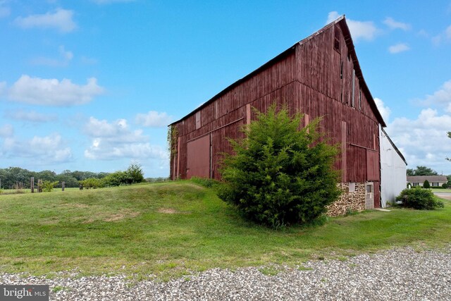 back of house with a lawn