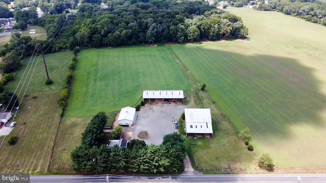 birds eye view of property with a rural view