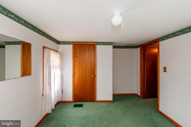 unfurnished bedroom featuring light colored carpet