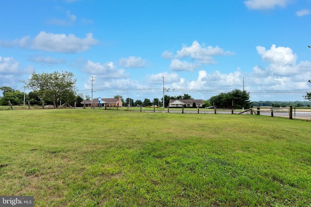 view of yard with a rural view