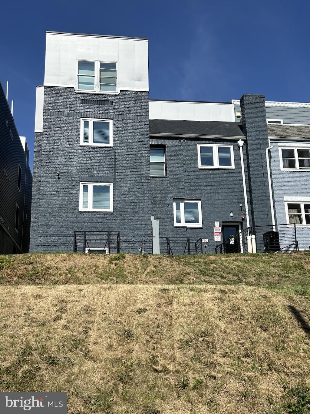 rear view of house with a lawn