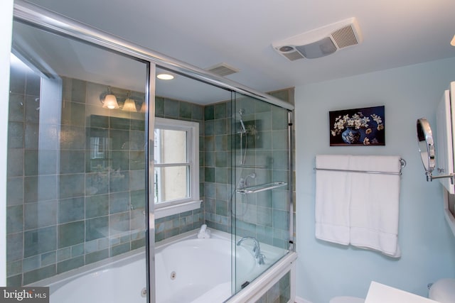 bathroom featuring toilet and enclosed tub / shower combo