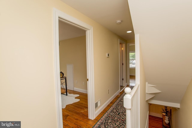 corridor featuring hardwood / wood-style floors