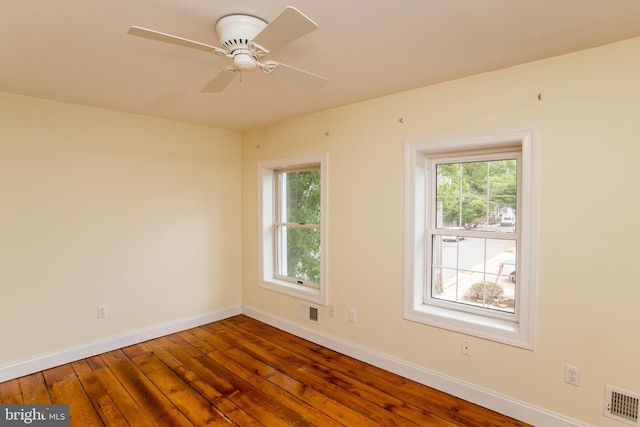 unfurnished room with ceiling fan and hardwood / wood-style floors