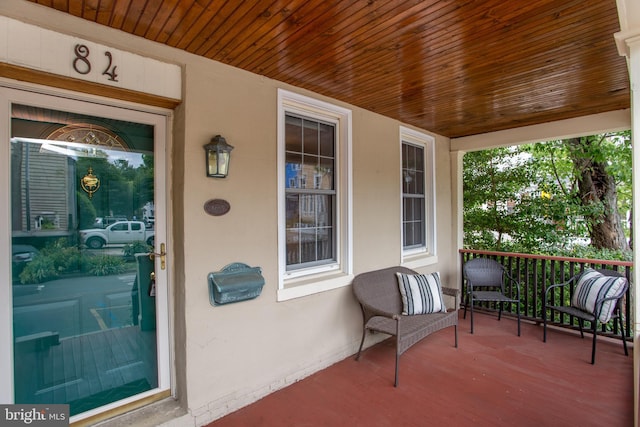 doorway to property featuring covered porch