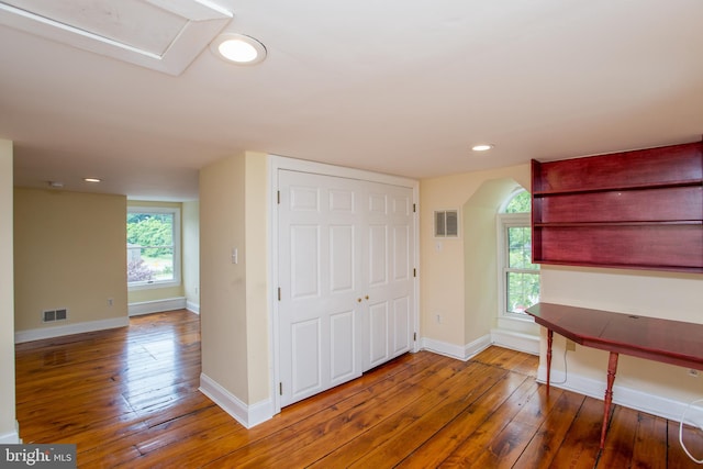 interior space with hardwood / wood-style flooring