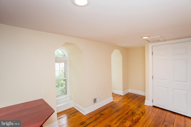 empty room with wood-type flooring