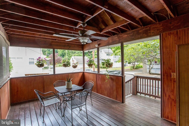 sunroom featuring ceiling fan