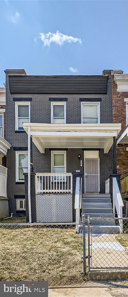 townhome / multi-family property with covered porch