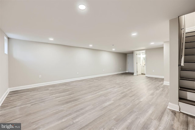 basement featuring light hardwood / wood-style flooring