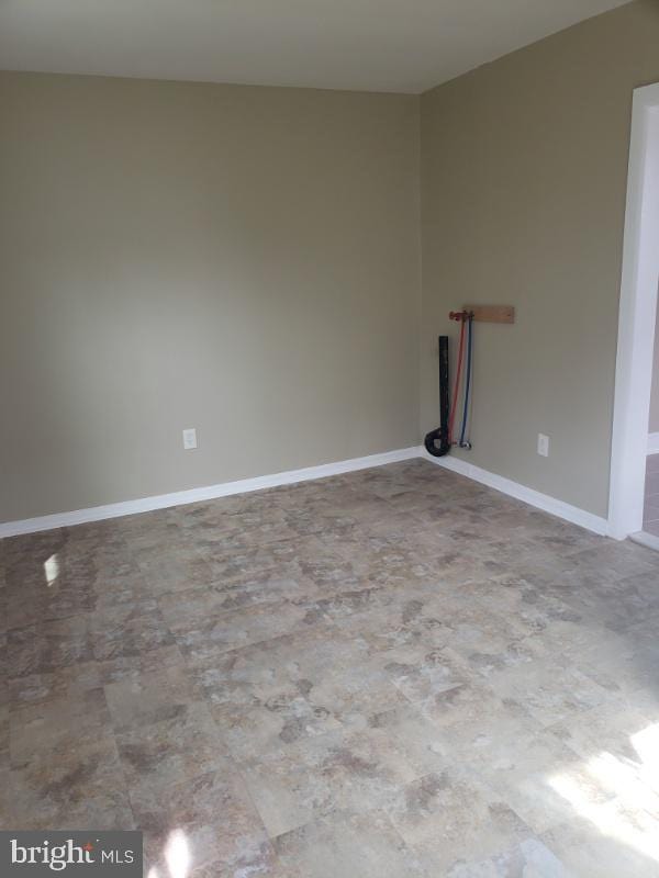 empty room with tile patterned flooring